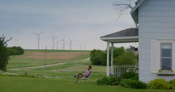 Tanner Faaborg sits in front of the family home in Iowa.